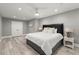 Comfortable bedroom with hardwood flooring, a ceiling fan, and a cozy queen bed at 303 Rolling Rock Se Rd, Marietta, GA 30067