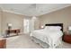 Bedroom featuring a ceiling fan, ensuite bath, and a neutral color scheme to provide a warm and relaxing ambiance at 303 Rolling Rock Se Rd, Marietta, GA 30067