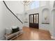 Bright foyer with hardwood floors, high ceilings, arched doorways and staircase at 303 Rolling Rock Se Rd, Marietta, GA 30067