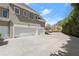 Spacious three-car garage and driveway with ample parking space for multiple vehicles at 303 Rolling Rock Se Rd, Marietta, GA 30067