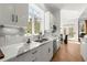 Kitchen featuring white countertops with stone detail, undermount sink, and stainless steel dishwasher at 303 Rolling Rock Se Rd, Marietta, GA 30067