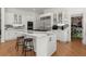 Bright, well-equipped kitchen with stainless steel appliances and white cabinets at 303 Rolling Rock Se Rd, Marietta, GA 30067