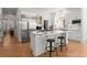 Modern white kitchen with stainless steel appliances and marble countertops at 303 Rolling Rock Se Rd, Marietta, GA 30067