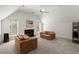Bright living room with vaulted ceilings, a fireplace, and large windows at 303 Rolling Rock Se Rd, Marietta, GA 30067