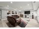 Living room with hardwood floors, a large television, and comfortable seating at 303 Rolling Rock Se Rd, Marietta, GA 30067