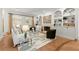 Cozy living room with fireplace, built-in shelving, and hardwood floors at 303 Rolling Rock Se Rd, Marietta, GA 30067