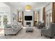 Cozy living room with fireplace, large windows, and comfortable seating at 303 Rolling Rock Se Rd, Marietta, GA 30067