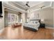Bright main bedroom boasting hardwood floors, a seating area and large windows with natural light at 303 Rolling Rock Se Rd, Marietta, GA 30067