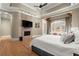 Spacious main bedroom featuring hardwood floors, a fireplace and a sitting area with lots of light at 303 Rolling Rock Se Rd, Marietta, GA 30067