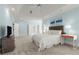 Large bedroom with white bedding, a ceiling fan, neutral paint, gray carpet, and an ensuite entrance at 303 Rolling Rock Se Rd, Marietta, GA 30067