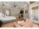 Large main bedroom offering a fireplace, tv, lounge area, and access to a private balcony at 303 Rolling Rock Se Rd, Marietta, GA 30067