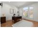 Charming office featuring hardwood floors, plantation shutters, and a classic wooden desk at 303 Rolling Rock Se Rd, Marietta, GA 30067