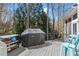 Outdoor patio with modern grill setup on wood deck, ready for grilling and entertaining at 303 Rolling Rock Se Rd, Marietta, GA 30067