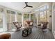 Screened porch with comfortable seating and wooded views at 303 Rolling Rock Se Rd, Marietta, GA 30067