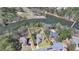 Aerial view of the property showcasing its prime waterfront location and well-manicured lawn surrounded by mature trees at 4852 Jacobs Cove Pt, Buford, GA 30519