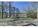 Landscaped backyard with a lake view at 4852 Jacobs Cove Pt, Buford, GA 30519