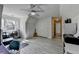 Bright bonus room featuring multiple work areas, closet, and wood look flooring at 4852 Jacobs Cove Pt, Buford, GA 30519