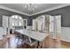 Dining room with hardwood floors leads to the foyer and living room at 4852 Jacobs Cove Pt, Buford, GA 30519