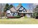 Beautiful two-story home featuring manicured lawn, tasteful landscaping and traditional design elements at 4852 Jacobs Cove Pt, Buford, GA 30519