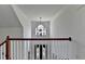 Elegant foyer with high ceilings, chandelier, and detailed doorway at 4852 Jacobs Cove Pt, Buford, GA 30519