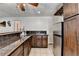 Kitchen with granite countertops, stainless steel refrigerator, and ample cabinet space at 4852 Jacobs Cove Pt, Buford, GA 30519
