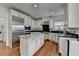 Well-equipped kitchen with stainless steel appliances, an island, granite countertops, and custom cabinetry at 4852 Jacobs Cove Pt, Buford, GA 30519
