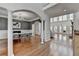 Open concept living room and dining room with hardwood floors and plenty of natural light at 4852 Jacobs Cove Pt, Buford, GA 30519