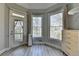 Bright main bedroom with walkout access, large windows, and neutral color palette at 4852 Jacobs Cove Pt, Buford, GA 30519