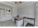 Bright home office featuring custom built-ins, modern desk, and neutral color palette at 4852 Jacobs Cove Pt, Buford, GA 30519