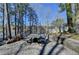 Stone patio with outdoor seating and lake views, ideal for entertaining at 4852 Jacobs Cove Pt, Buford, GA 30519