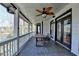 Spacious porch with a dining table and a lovely view of the backyard at 4852 Jacobs Cove Pt, Buford, GA 30519
