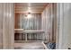 Relaxing sauna room featuring wood paneled walls and ceiling and built in benches at 4852 Jacobs Cove Pt, Buford, GA 30519