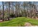 Expansive backyard boasts beautiful green grass with sitting area, perfect for relaxing at 790 Denards Se Ml, Marietta, GA 30067