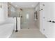 Elegant bathroom with a glass shower and soaking tub at 790 Denards Se Ml, Marietta, GA 30067