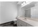 Bathroom features a marble countertop, white vanity, and glass enclosed shower at 790 Denards Se Ml, Marietta, GA 30067