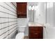 Cozy bathroom with shower and wood vanity at 790 Denards Se Ml, Marietta, GA 30067