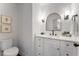 This powder room features a modern vanity, elegant fixtures, and tasteful decor at 790 Denards Se Ml, Marietta, GA 30067