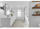 Bright bathroom with dual sinks and shelving for storage at 790 Denards Se Ml, Marietta, GA 30067