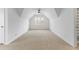 Large bonus room with high ceilings and neutral carpet at 790 Denards Se Ml, Marietta, GA 30067
