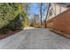 Long driveway leading to a two-car garage, next to a brick and Tudor-style home at 790 Denards Se Ml, Marietta, GA 30067