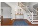 Bright entryway with hardwood floors, elegant staircase, and stylish decor at 790 Denards Se Ml, Marietta, GA 30067