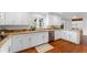 Bright kitchen featuring granite countertops, stainless steel appliances, and white cabinetry at 790 Denards Se Ml, Marietta, GA 30067