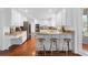 Bright kitchen features white cabinets, stainless appliances, granite counters, and breakfast bar at 790 Denards Se Ml, Marietta, GA 30067