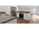 Modern kitchen with stainless steel appliances and granite countertops at 790 Denards Se Ml, Marietta, GA 30067