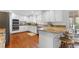 This open kitchen features stainless appliances, granite counters and a breakfast bar at 790 Denards Se Ml, Marietta, GA 30067