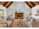 The living room features a stone fireplace, wood ceiling, hardwood floors, and bright windows at 790 Denards Se Ml, Marietta, GA 30067