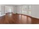 Spacious living room with gleaming wood floors and French doors at 790 Denards Se Ml, Marietta, GA 30067