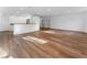 Bright open-concept living room with hardwood floors and a breakfast bar leading to the kitchen at 790 Denards Se Ml, Marietta, GA 30067