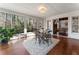 Sunroom with a round table and a view of the trees at 790 Denards Se Ml, Marietta, GA 30067