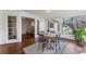 Eat-in kitchen adjacent to a sunroom with natural light and outdoor views at 790 Denards Se Ml, Marietta, GA 30067